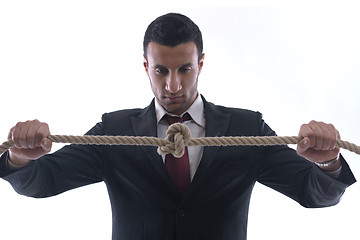 Image showing business man with rope isolated on white background