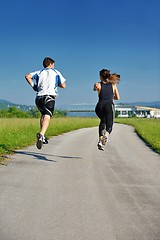 Image showing Young couple jogging at morning