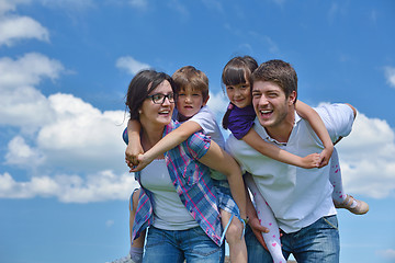 Image showing happy young family have fun outdoors