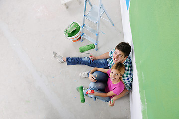 Image showing happy young cople relaxing after painting in new home