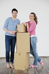 Image showing Young couple moving in new house