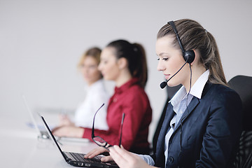 Image showing business woman group with headphones