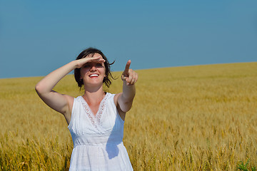 Image showing young woman in wheat field at summer