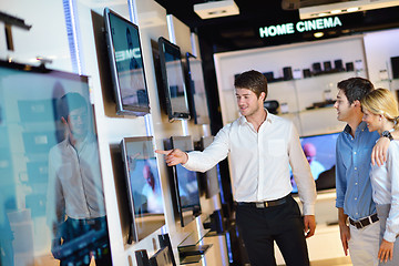 Image showing Young couple in consumer electronics store