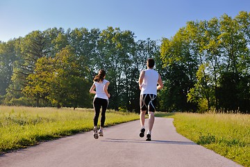 Image showing Young couple jogging