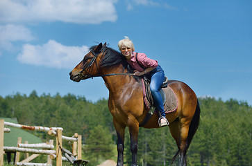 Image showing happy woman  on  horse