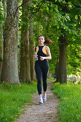 Image showing Young beautiful  woman jogging