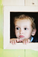 Image showing happy child in a window