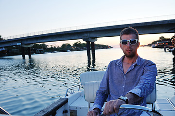 Image showing portrait of happy young man on boat