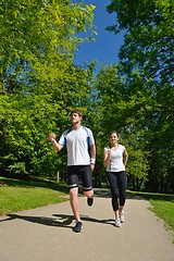 Image showing Young couple jogging