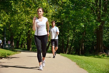 Image showing Young couple jogging at morning