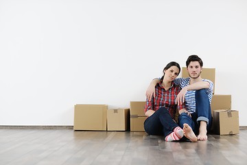 Image showing Young couple moving in new house