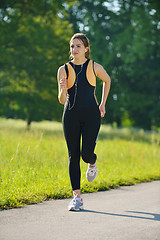 Image showing Young couple jogging at morning