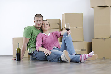 Image showing Young couple moving in new home