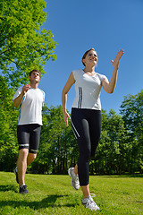 Image showing Young couple jogging