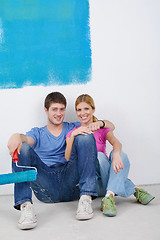 Image showing happy young cople relaxing after painting in new home