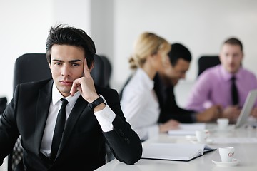 Image showing young business man at meeting