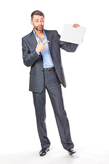 Image showing Full length portrait businessman showing an empty board to write