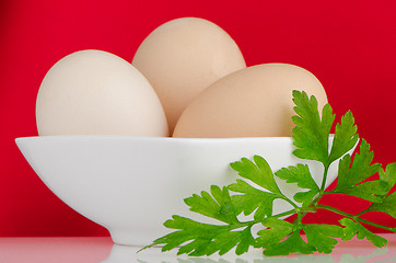 Image showing Three eggs in the bowl 