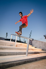 Image showing Skateboarder on rail 