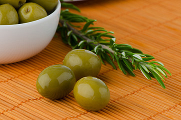 Image showing Green olives in a white ceramic bowl