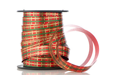 Image showing Spool with decorative red ribbon