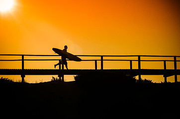 Image showing Surfer running to the beach