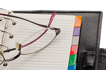 Image showing Leather notebook and glasses