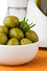 Image showing Green olives in a white ceramic bowl