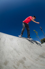 Image showing Skateboarder on a curb 