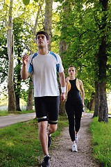 Image showing Young couple jogging