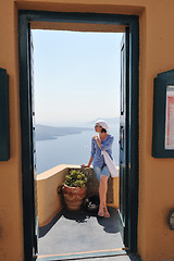 Image showing Greek woman on the streets of Oia, Santorini, Greece