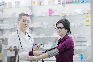 Image showing Checking blood pressure and heart rate