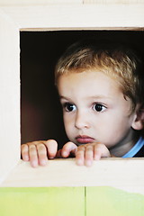 Image showing happy child in a window