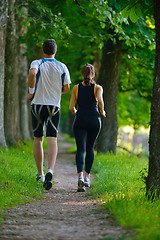 Image showing Young couple jogging