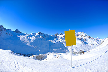 Image showing Sign board at High mountains under snow in the winter