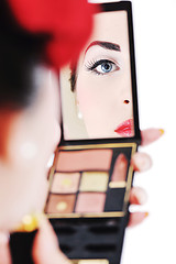 Image showing beautiful young woman applying makeup