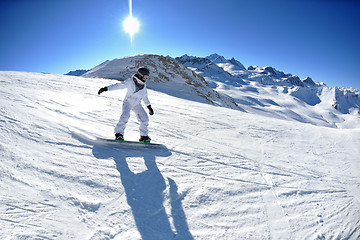 Image showing skiing on fresh snow at winter season at beautiful sunny day