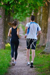 Image showing Young couple jogging