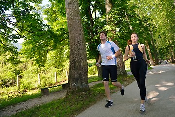 Image showing Young couple jogging