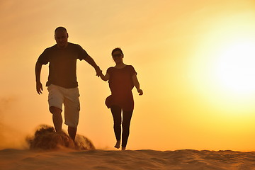 Image showing couple enjoying the sunset