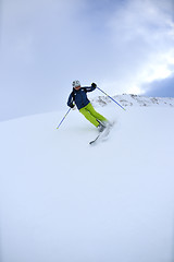 Image showing skiing on fresh snow at winter season at beautiful sunny day