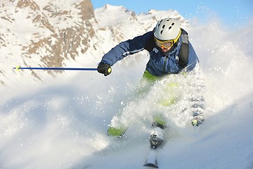 Image showing skiing on fresh snow at winter season at beautiful sunny day