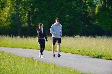 Image showing Young couple jogging