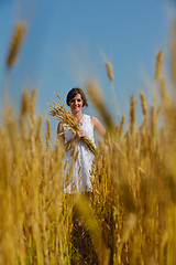 Image showing young woman in wheat field at summer