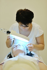 Image showing woman with facial mask in cosmetic studio