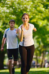 Image showing Young couple jogging