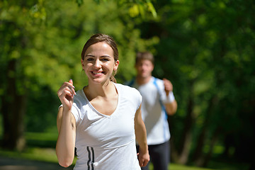 Image showing Young couple jogging at morning