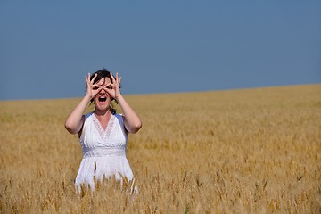 Image showing young woman in wheat field at summer