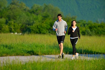 Image showing Young couple jogging